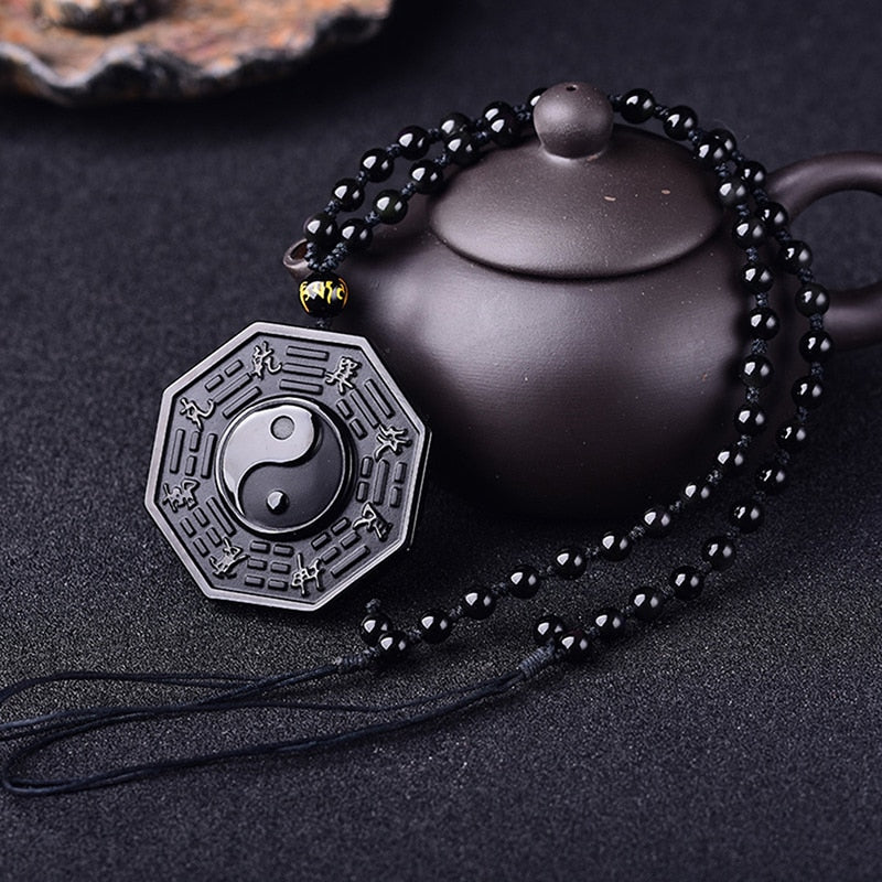 Halskjede med obsidian yin og yang