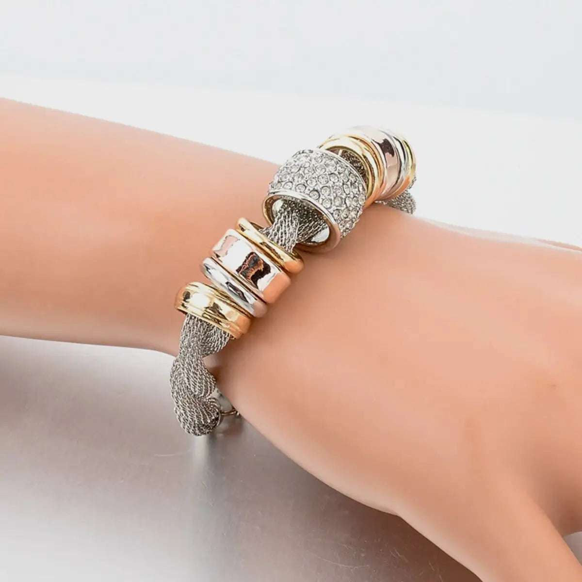 Armbånd med flettede ringer